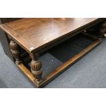 19th century oak refectory style table with carved frieze raised on turned supports united by