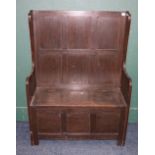 19th century oak settle with high panel back, lift up storage seat and fielded panel base, 124cm