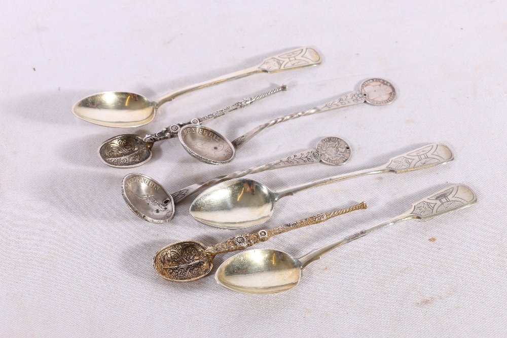 Three Russian 84 zloty grade silver teaspoons with AA 1889 mark, a pair of anointing spoons and