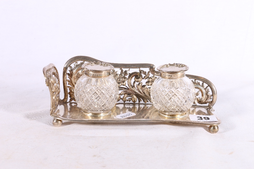 Edwardian Art Nouveau period silver inkwell desk stand with pierced scroll border and twin hobnail