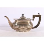 Edwardian silver teapot with gadrooned decoration, Birmingham 1908, makers marks rubbed, 390g gross