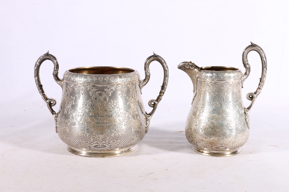 Victorian silver sugar and cream jug with gilded interior and engraved decoration by Edward & John