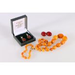 Amber style jewellery including butterscotch coloured necklace of graduated beads, a butterscotch