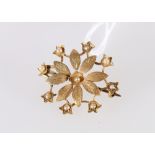 15ct gold and seed pearl combination pendant brooch modelled as a flower, stamped 15ct to reverse,