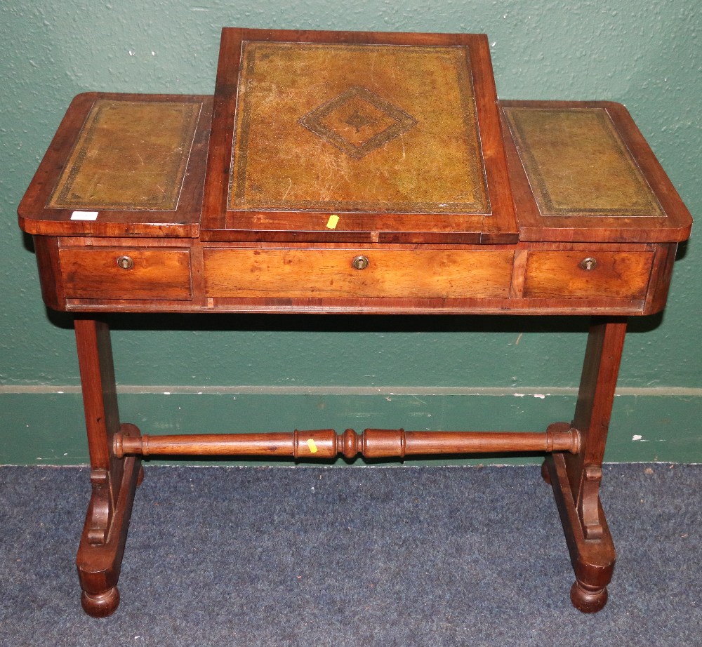 Victorian rosewood desk, the pop up top with inset leather skivers raised one trestle base united by