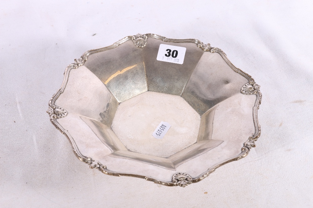 George V silver octagonal fluted bowl raised on four feet by Elkington and Co Ltd, Birmingham