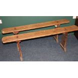 Pair of rustic oak benches with trestle ends, 147cm long