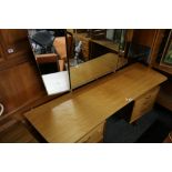 Mid century walnut and teak dressing table by Alfred Cox for AC Furniture, the triptych mirrors over