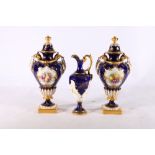 Pair of Royal Worcester twin handled porcelain urns with painted floral vignettes by Hawkins on a