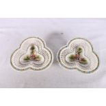 Pair of French trefoil shaped porcelain lattice weave baskets decorated with vignettes of figures,