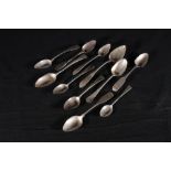 Eleven antique silver spoons including three Irish fiddle pattern teaspoons by Thomas Townsend,