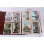 A brown binder folder containing over 500 Canadian postcards including Arnprior Lumber Yards,