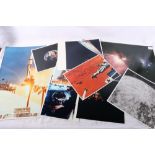 A collection of Nasa space related photographs including space shuttles, moon surface, pod, earth,