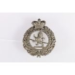 Scottish plaid brooch with Queen's crown over thistle wreath containing rampant lion with motto "Dia