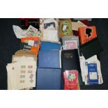 An extensive collection of used world stamps, mostly loose and unsorted material, some prepared