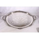 Victorian silver twin handled tray with feathered edge and foliate scroll engraved field,