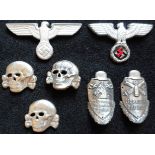 A small collection of alloy eagles, totenkopf and two stick badges