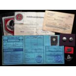 A good collection of  German WW II badges and documents relating to Reichsarbeitdienst member