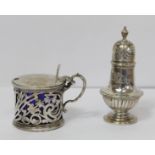 Silver pierced drum mustard pot by Huttons, and a pepperette, part fluted by C. S. Harris, both