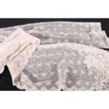A needle lace stole with rounded ends decorated with flowerhead couched work and floral scalloped