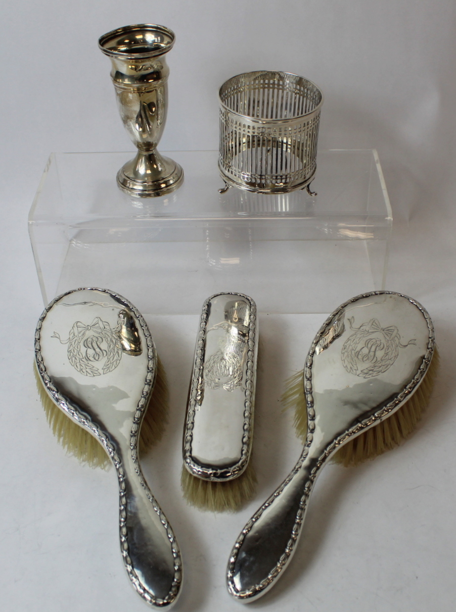 Silver vase, a similar bottle holder and three brushes.