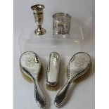 Silver vase, a similar bottle holder and three brushes.