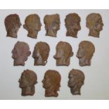 Set of twelve 19th century Grand Tour bas relief small plaster portrait plaques of Roman Emperors,