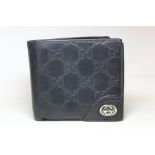 Vintage black leather Gucci wallet with embossed double G lattice pattern and double G metal