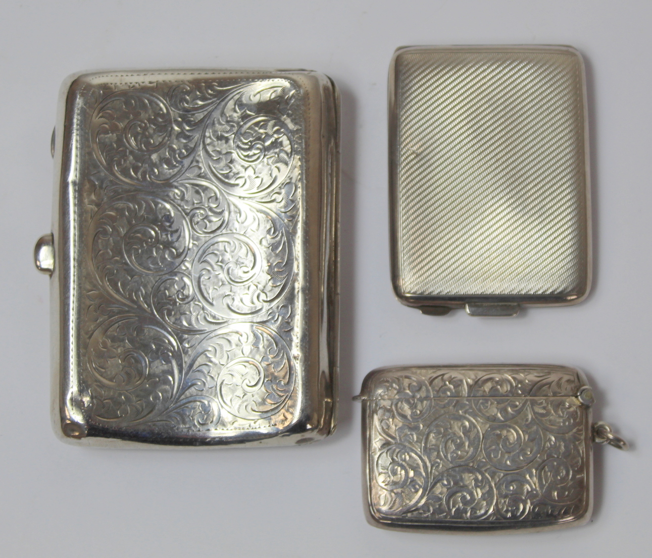 Engraved silver cigarette case, 1909 and two vesta cases. 3½ oz. (3). - Image 3 of 3