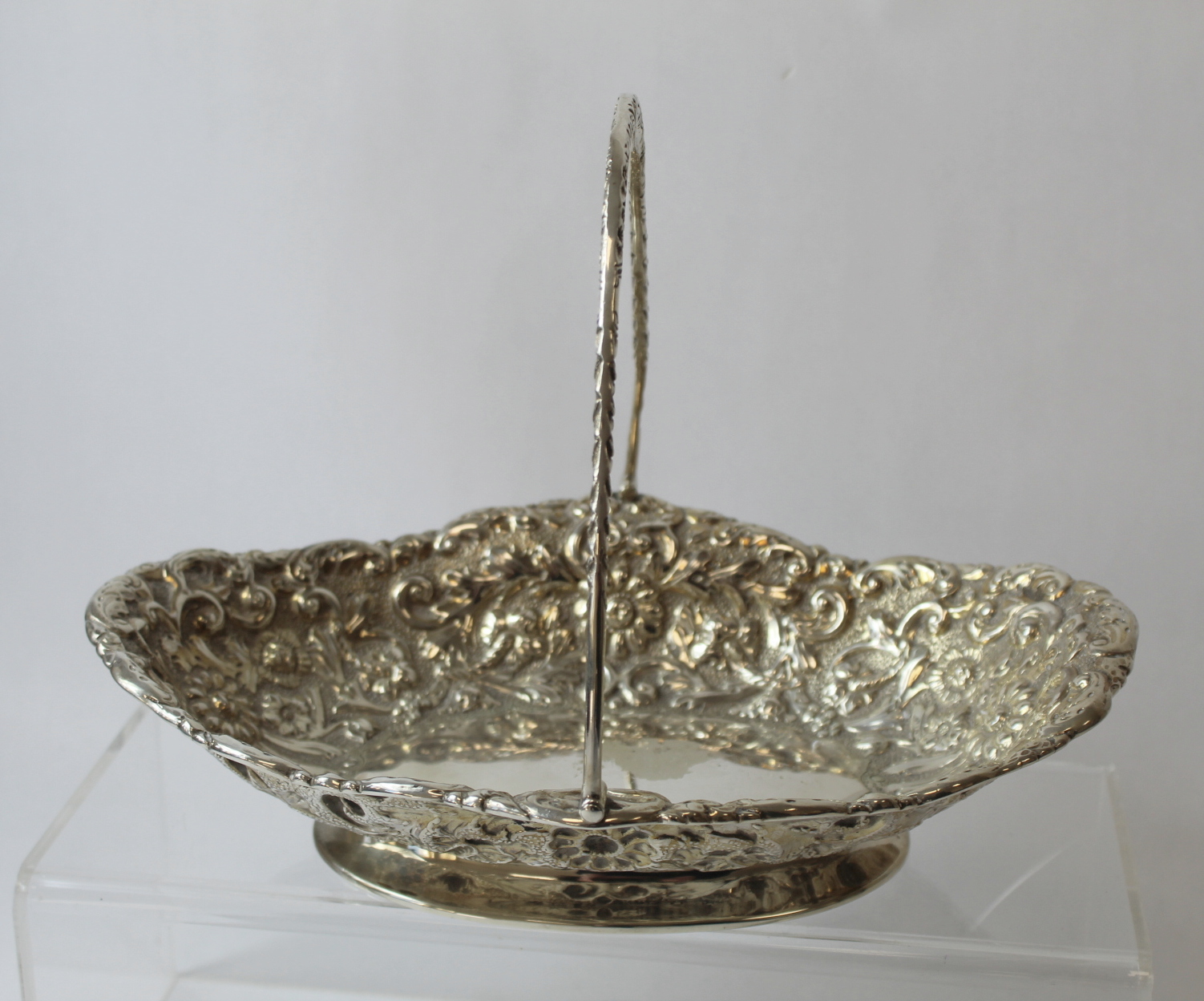 Silver cake basket oval with embossed scrolls and flowerheads by Finley & Taylor 1888. 9oz.