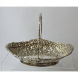 Silver cake basket oval with embossed scrolls and flowerheads by Finley & Taylor 1888. 9oz.