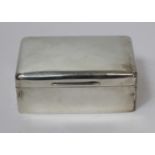 Silver plain cigarette box by W. Comyns 1910. 14cm.