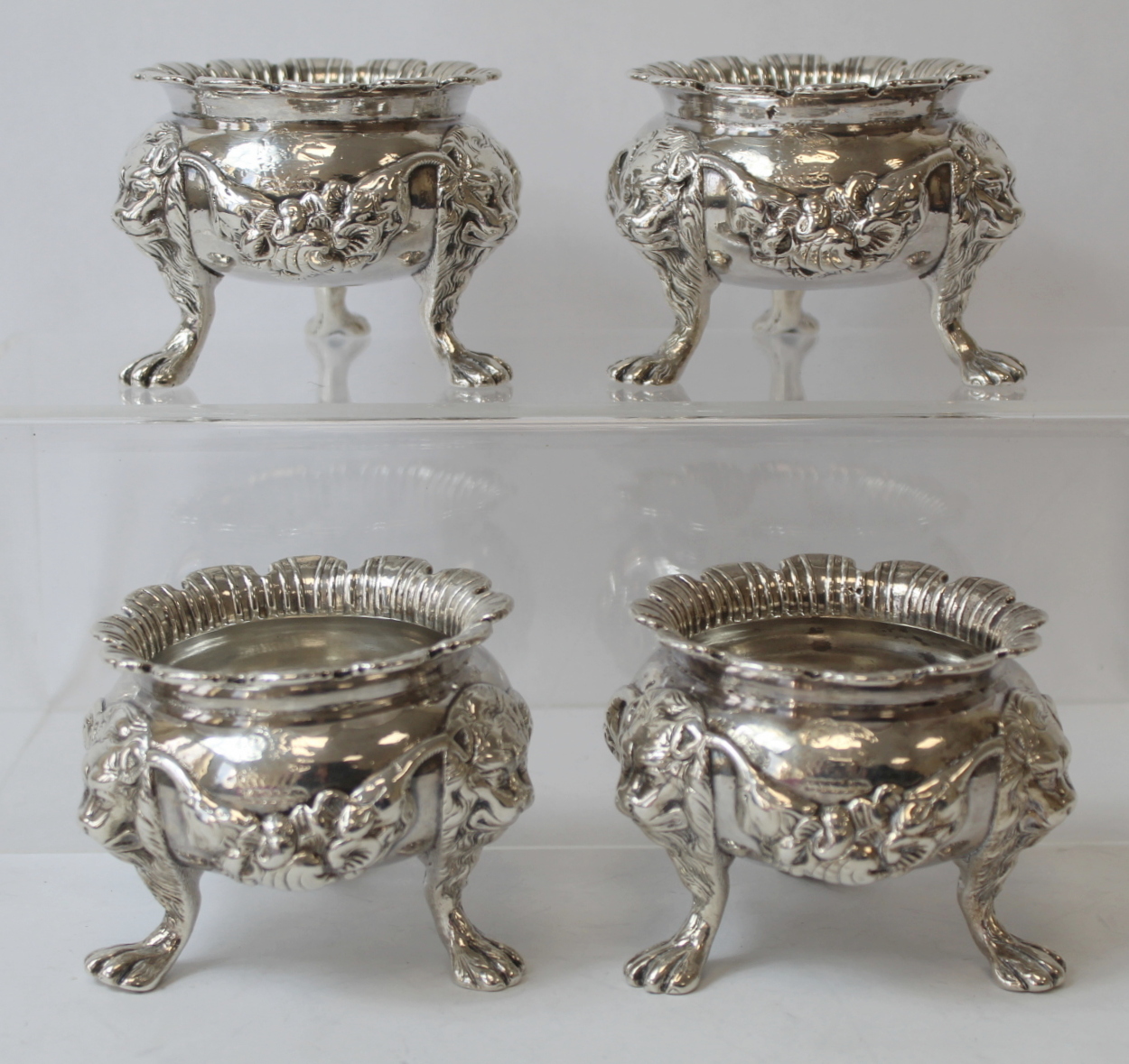 Impressive set of four cast silver salts of good gauge with cast swags and deeply gadrooned edges