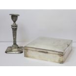 Egyptian plain silver cigar box, 18cm square; also a candlestick 1902, loaded. (2).