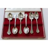 Set of eight silver trefid dessert spoons, cased.