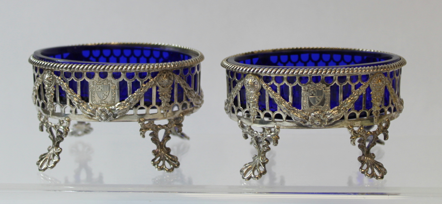 Set of four silver oval salts, pierced with applied embossed swags upon openwork spreading feet, - Image 2 of 8