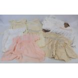 Six vintage child's smocked dresses, another plain flannel and two lace Christening gowns, c.1960s/