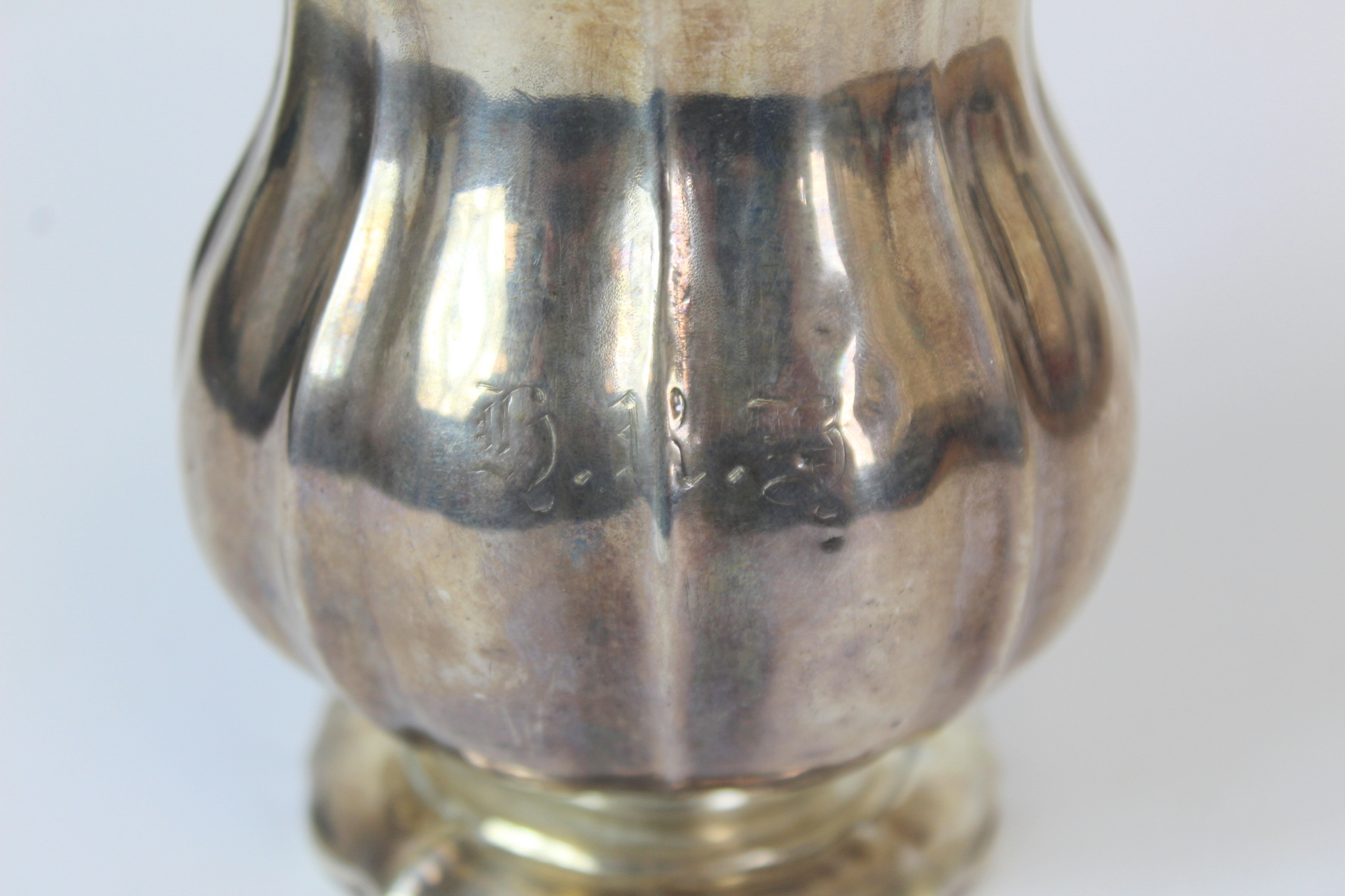 Silver cream jug of fluted baluster form with leafage handle on spreading foot, markers mark rubbed, - Image 3 of 3