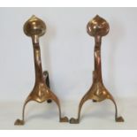 Pair of Arts and Crafts copper andirons the flat onion finial on flared strap support with bracket