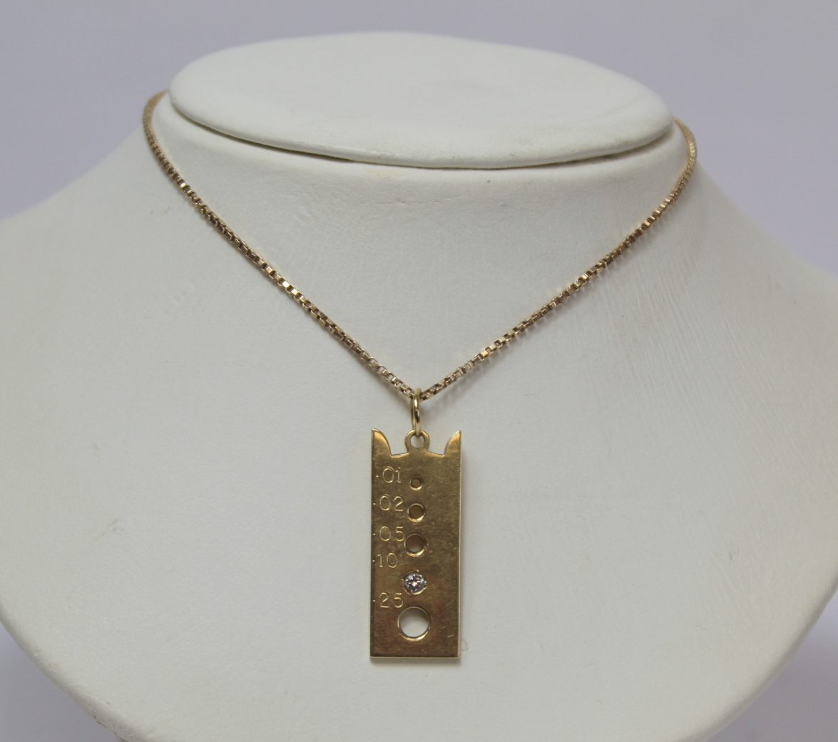 18ct gold pendant modelled as a diamond gauge with .10 of diamond on 9ct gold necklet.18ct - 7.7g, - Image 2 of 4