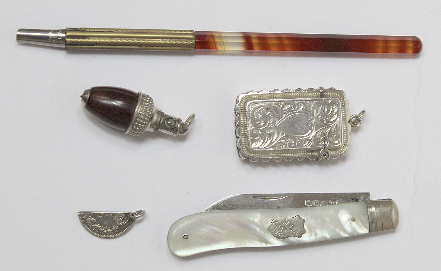 Silver engraved vesta case Birmingham 1888, a fruit knife, a pencil with Stanhope views of