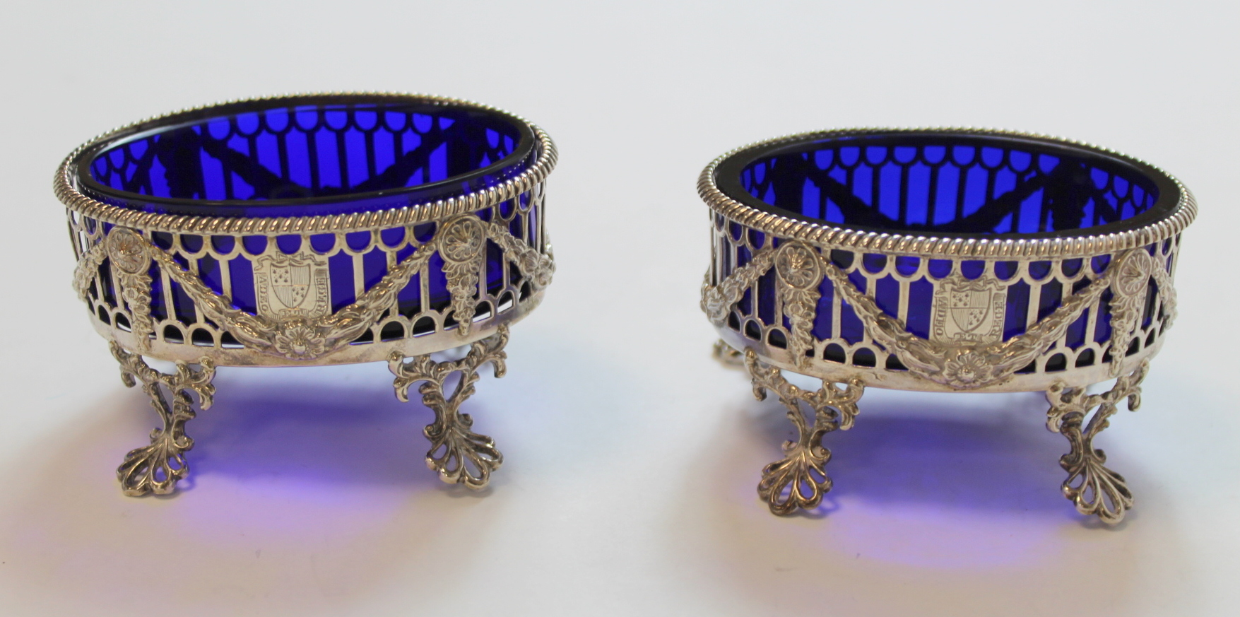 Set of four silver oval salts, pierced with applied embossed swags upon openwork spreading feet, - Image 3 of 8