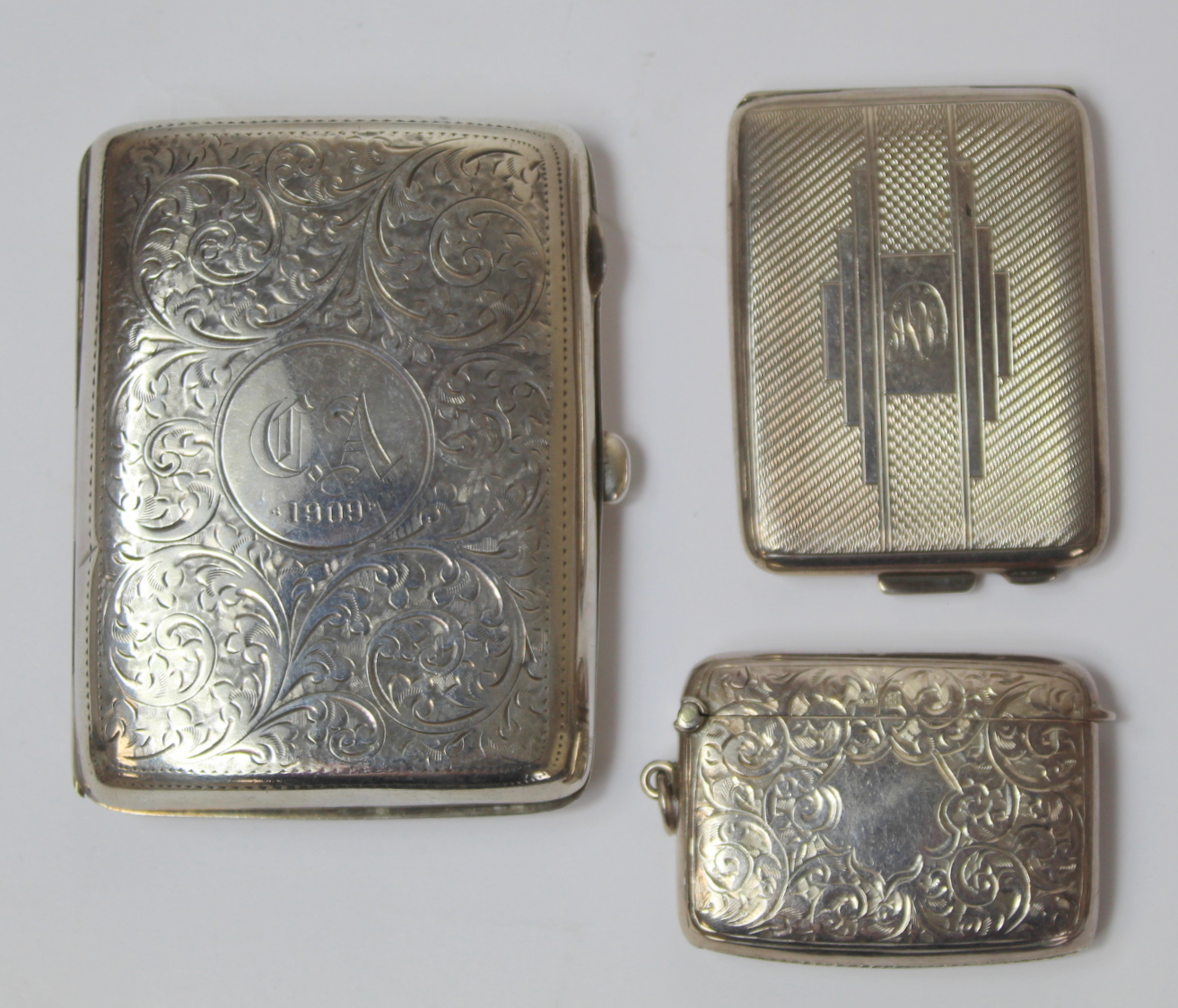 Engraved silver cigarette case, 1909 and two vesta cases. 3½ oz. (3). - Image 2 of 3