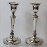 Pair of silver table candlesticks, circular section with inverted tapering  stems, Sheffield 1904,