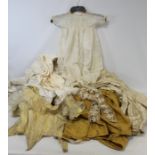 Vintage silk and lace edged baby's gown, Victorian lace edged petticoat, a cream silk and an ochre