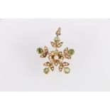 Victorian gold brooch pendant with five peridot and pearl sprays and flowerhead. '15ct'. 5.4g.