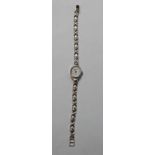 Lady's 'Geneve' white gold bracelet watch '18k', quartz. 21g gross.