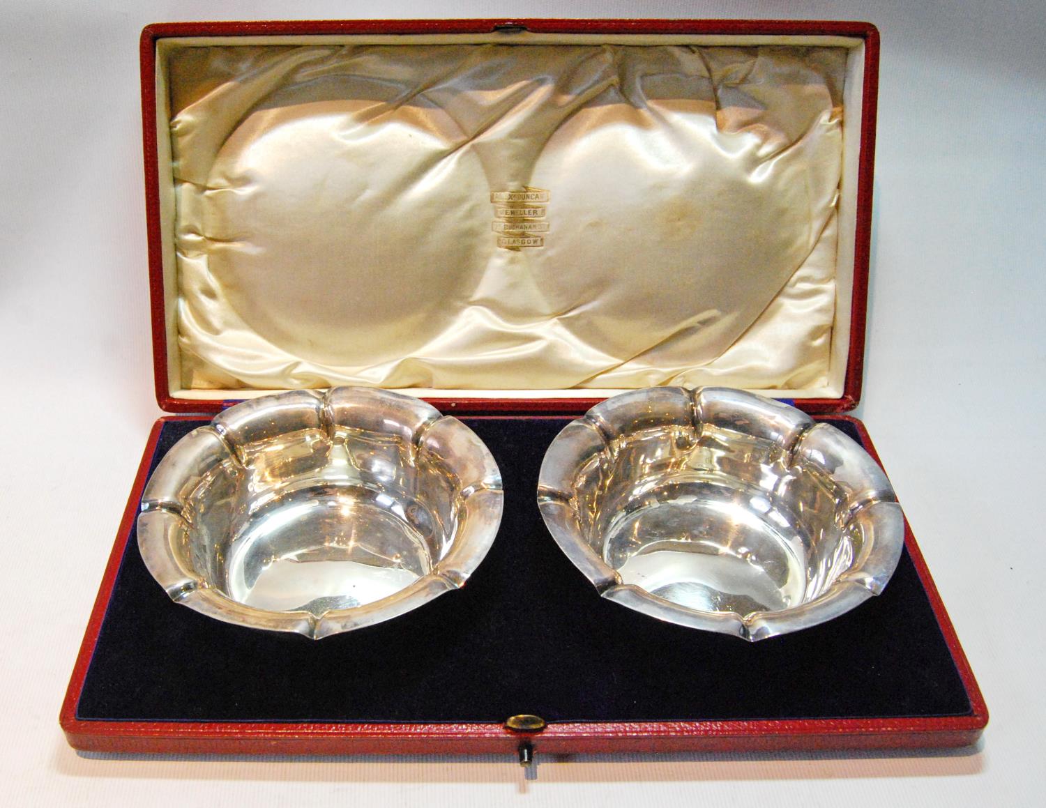 Pair of circular sweetmeat dishes with notched edges, by Harry Atkin, Sheffield 1900, 5oz, cased.