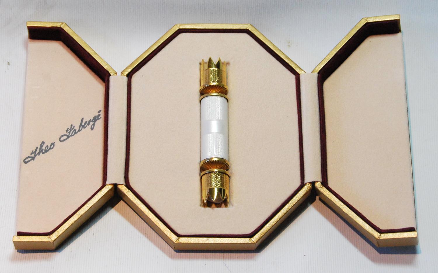 Theo Fabergé silver gilt novelty cracker with guilloché white enamel enclosing a gilt bluebell