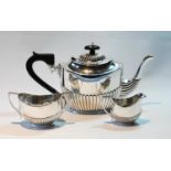 Silver composite three-piece tea set, oval fluted, Chester 1916, and Birmingham 1903, 15½oz.